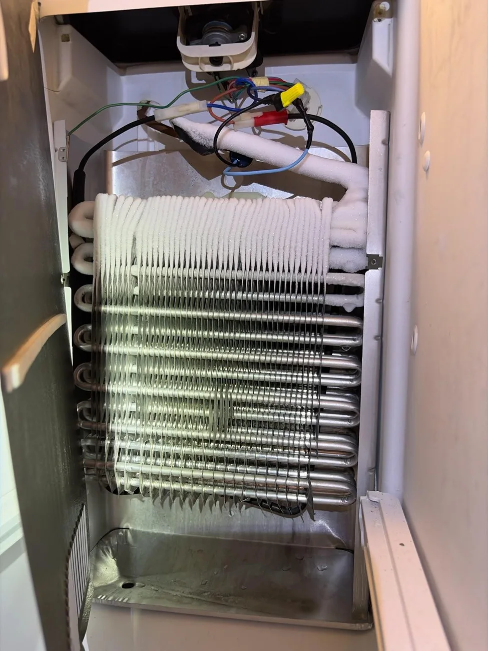 A view of a refrigerator’s internal components.